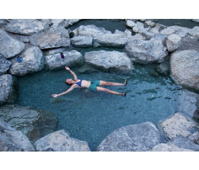 Jo Deurbrouck soaking in natural hot spring pool