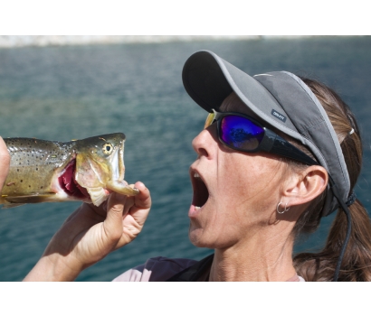 Jo Deurbrouck having fun with cutthroat trout while fly fishing
